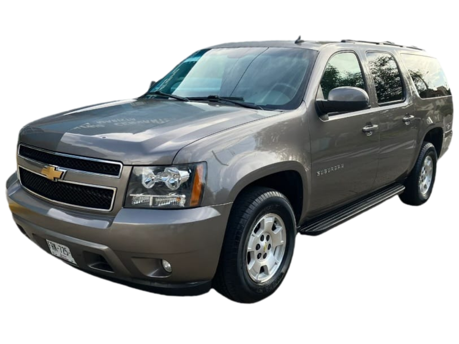 Chevrolet Suburban color champagne, SUV grande de 8 pasajeros con tres filas de asientos