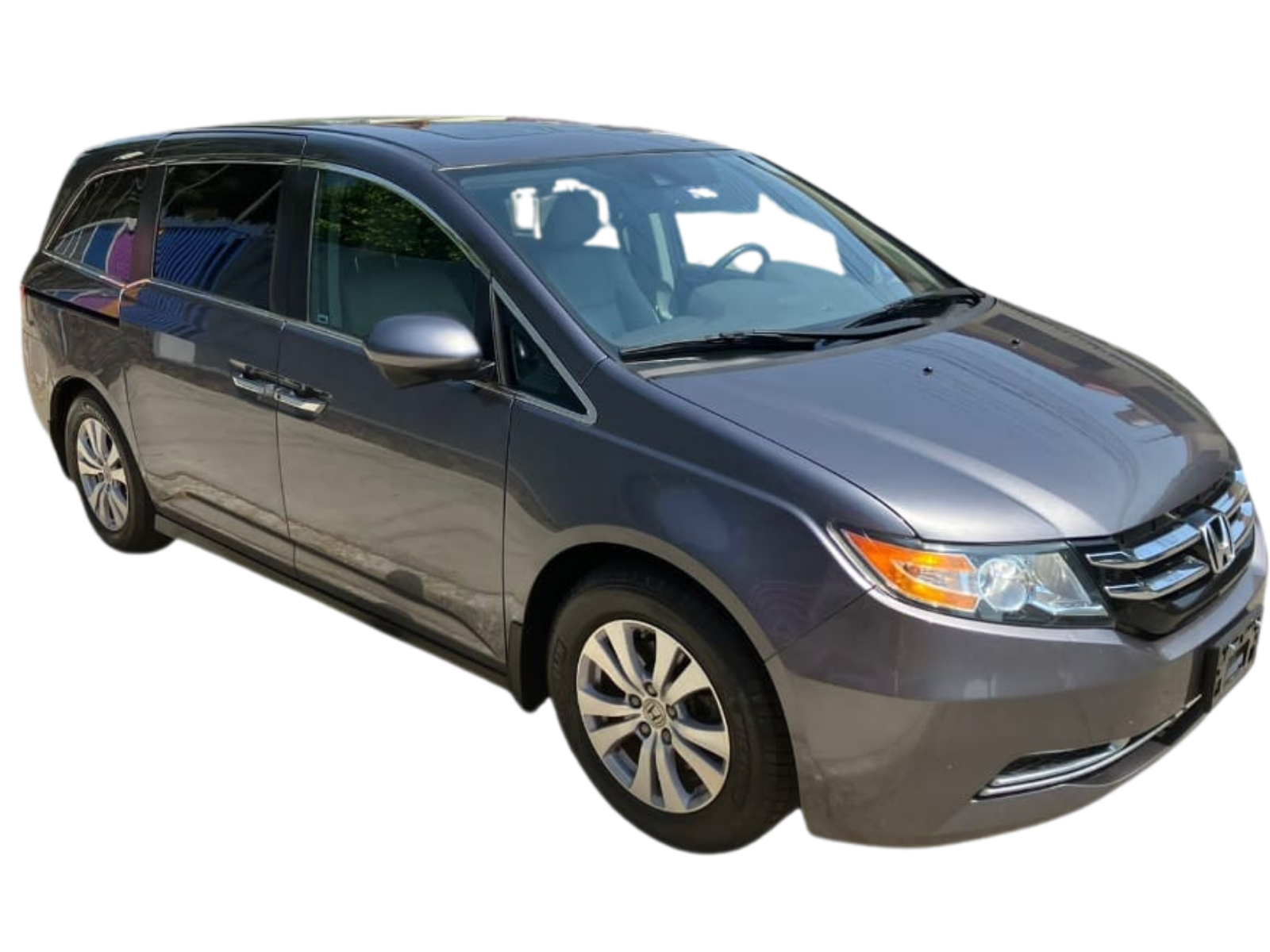 Honda Odyssey color gris, minivan familiar de 8 pasajeros con tres filas de asientos